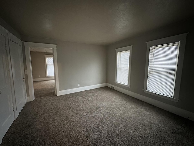1803 Portage St, Kalamazoo, MI 49001 - carpeted empty room featuring baseboards