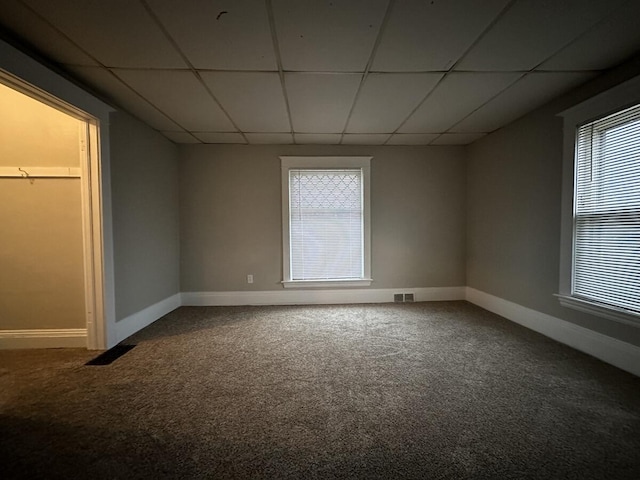 1803 Portage St, Kalamazoo, MI 49001 - unfurnished bedroom with a drop ceiling, carpet flooring, and baseboards