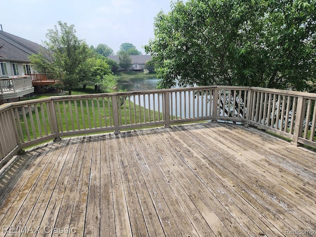 5659 Victory Cir, Sterling Heights, MI 48310 - wooden terrace with a water view and a yard