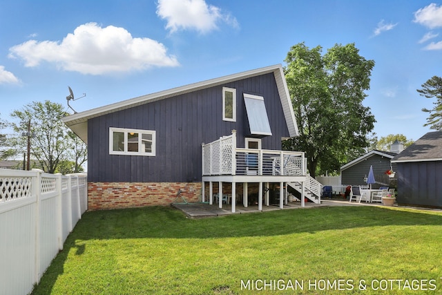 2259 Ottawa Beach Rd, Holland, MI 49424 - back of house featuring stairway, a deck, a patio area, and brick siding