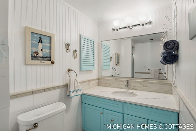 2259 Ottawa Beach Rd, Holland, MI 49424 - bathroom featuring toilet and vanity