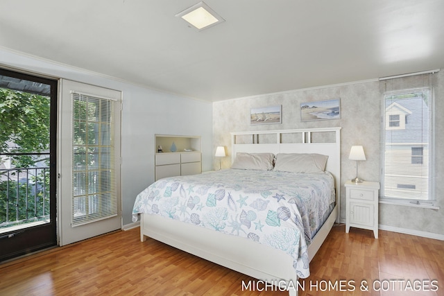 2259 Ottawa Beach Rd, Holland, MI 49424 - bedroom with multiple windows, ornamental molding, wood finished floors, and baseboards
