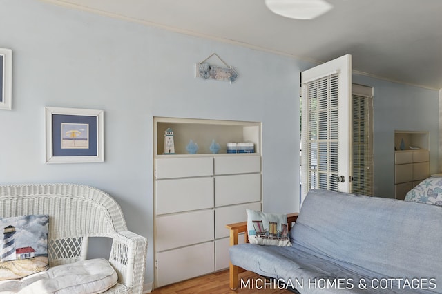 2259 Ottawa Beach Rd, Holland, MI 49424 - bedroom featuring ornamental molding and wood finished floors