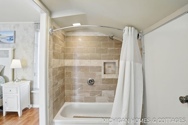 2259 Ottawa Beach Rd, Holland, MI 49424 - bathroom with shower / bathtub combination with curtain and wood finished floors