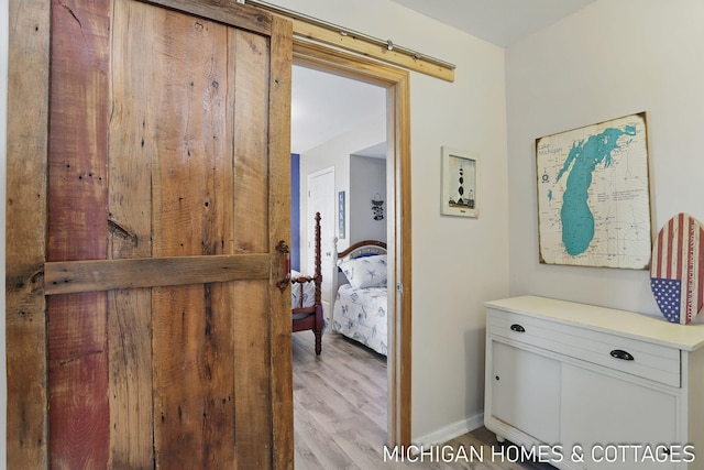 2259 Ottawa Beach Rd, Holland, MI 49424 - corridor with light wood finished floors and baseboards