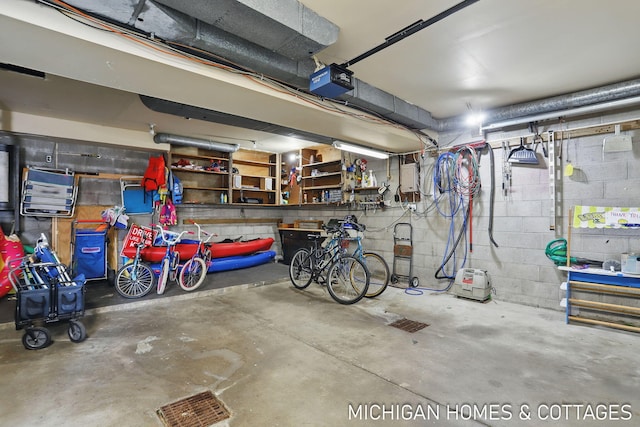 2259 Ottawa Beach Rd, Holland, MI 49424 - garage with a garage door opener, electric panel, and concrete block wall