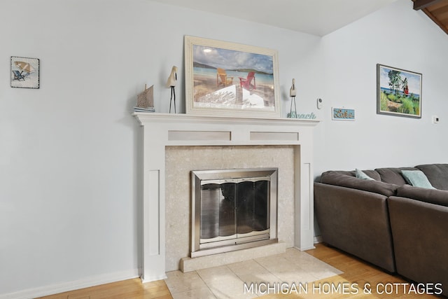 2259 Ottawa Beach Rd, Holland, MI 49424 - living area with wood finished floors and a fireplace with flush hearth