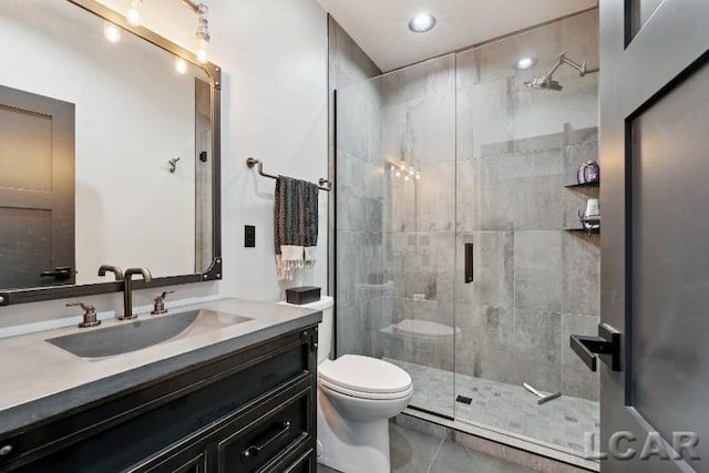 8676 Cherry Point Dr, Manitou Beach, MI 49253 - full bathroom featuring toilet, vanity, a stall shower, and tile patterned flooring