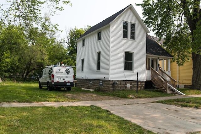 636 Mabel St, Kalamazoo, MI 49007 - view of front of house with a front lawn and roof with shingles