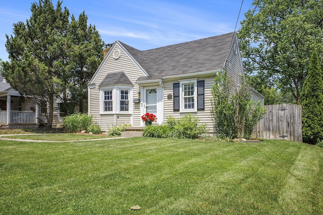 2147 Academy Dr NE, Grand Rapids, MI 49503 - cape cod house featuring roof with shingles and a chimney