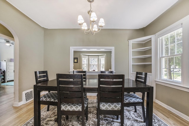 2147 Academy Dr NE, Grand Rapids, MI 49503 - dining space with healthy amount of natural light, light wood-type flooring, and baseboards