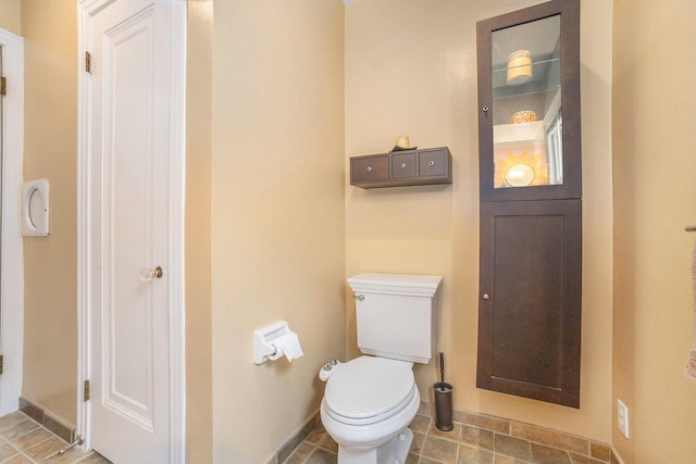 2147 Academy Dr NE, Grand Rapids, MI 49503 - bathroom featuring baseboards and toilet