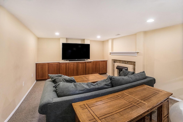 2147 Academy Dr NE, Grand Rapids, MI 49503 - living room featuring light carpet, baseboards, a tiled fireplace, and recessed lighting