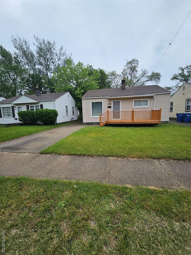 21222 Audrey Ave, Sterling Heights, MI 48091 - single story home featuring a deck, a front lawn, and concrete driveway
