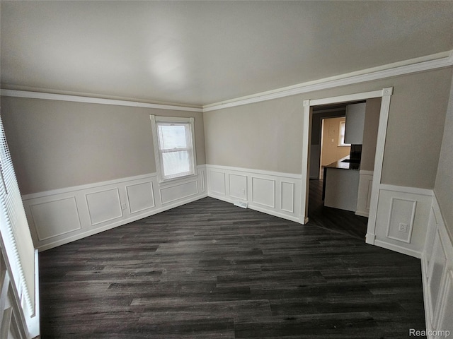 21222 Audrey Ave, Sterling Heights, MI 48091 - spare room with dark wood-style floors, wainscoting, crown molding, and a decorative wall