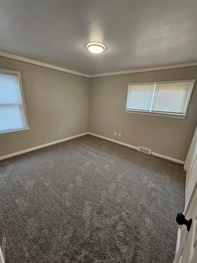21222 Audrey Ave, Sterling Heights, MI 48091 - unfurnished room with crown molding, healthy amount of natural light, and carpet flooring