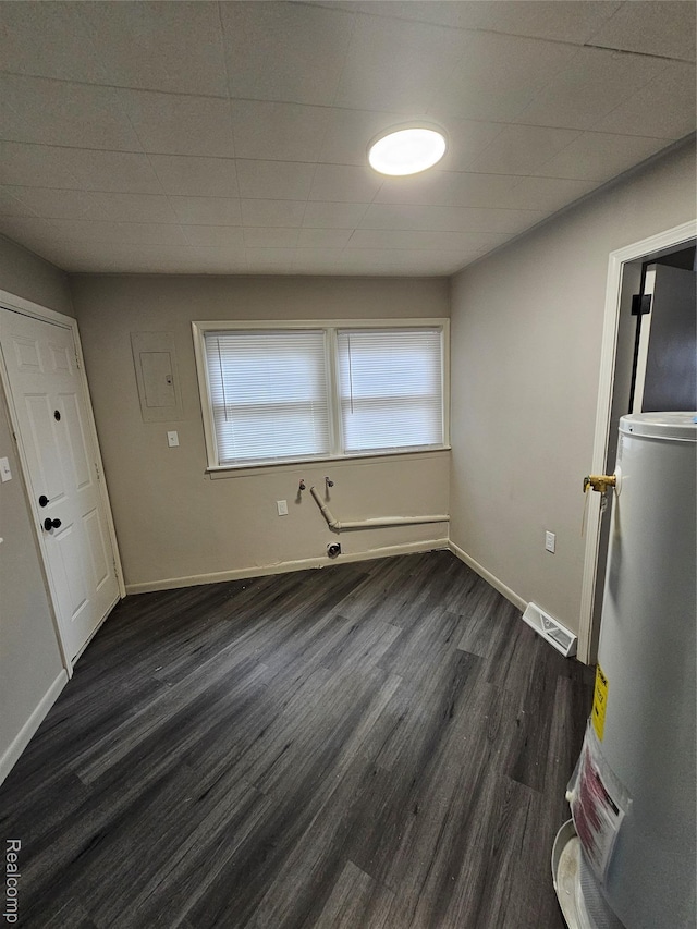 21222 Audrey Ave, Sterling Heights, MI 48091 - unfurnished dining area with electric water heater and dark wood-style flooring