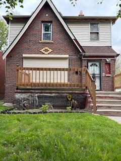 14882 Littlefield St, Detroit, MI 48227 - view of front of property with a front lawn, a chimney, and brick siding