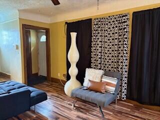 14882 Littlefield St, Detroit, MI 48227 - sitting room featuring ceiling fan, baseboards, and wood finished floors