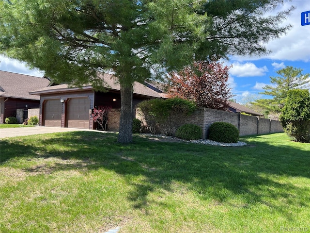 2205 Hammond Place Ctr, Traverse City, MI 49686 - view of front of property with driveway, an attached garage, and a shingled roof