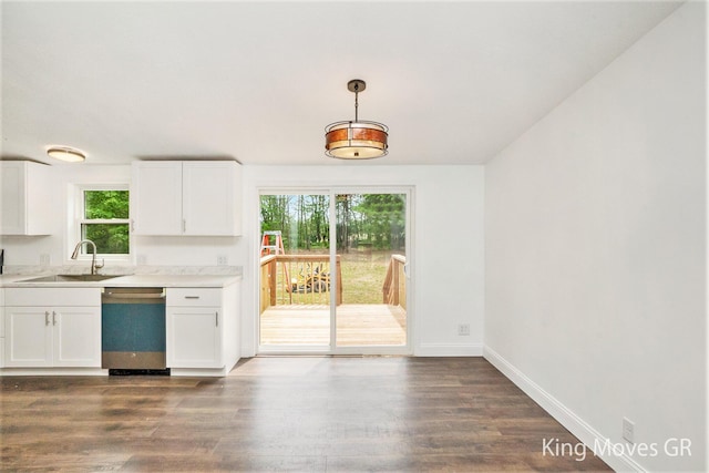 11690 21 Mile Rd NE, Sand Lake, MI 49343 - kitchen featuring stainless steel dishwasher, a sink, healthy amount of natural light, and light countertops