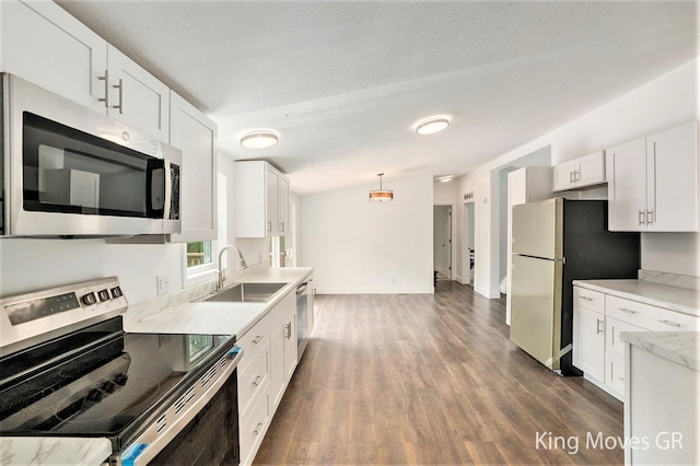11690 21 Mile Rd NE, Sand Lake, MI 49343 - kitchen featuring stainless steel appliances, a sink, dark wood-style floors, white cabinets, and pendant lighting