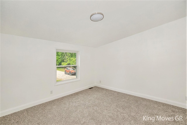 11690 21 Mile Rd NE, Sand Lake, MI 49343 - unfurnished room with light carpet and baseboards