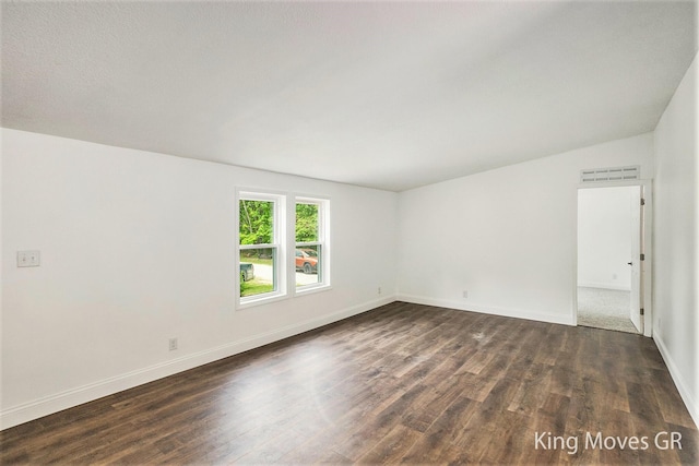 11690 21 Mile Rd NE, Sand Lake, MI 49343 - spare room with dark wood-style flooring and baseboards