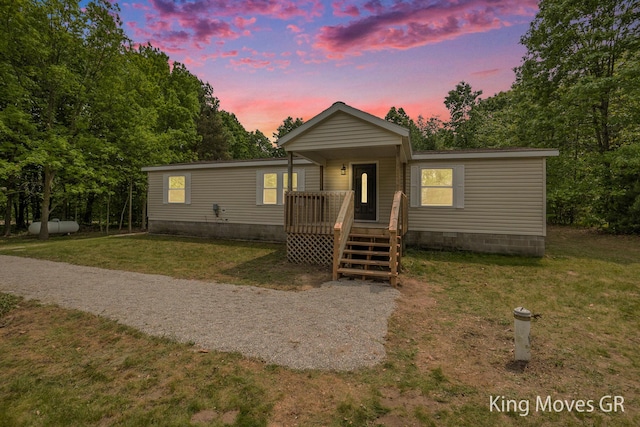 11690 21 Mile Rd NE, Sand Lake, MI 49343 - manufactured / mobile home with a yard