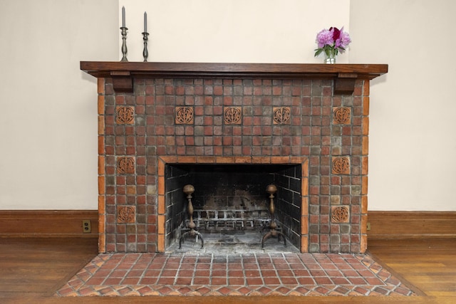 1706 S University Ave, Ann Arbor, MI 48104 - detailed view of wood finished floors and a fireplace with flush hearth