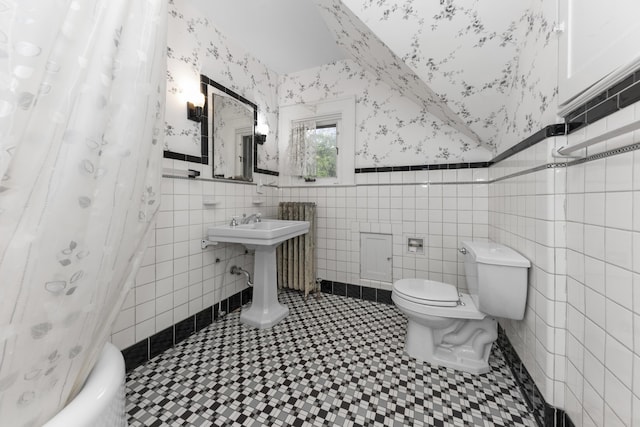 1706 S University Ave, Ann Arbor, MI 48104 - full bathroom featuring wallpapered walls, toilet, a wainscoted wall, and tile walls