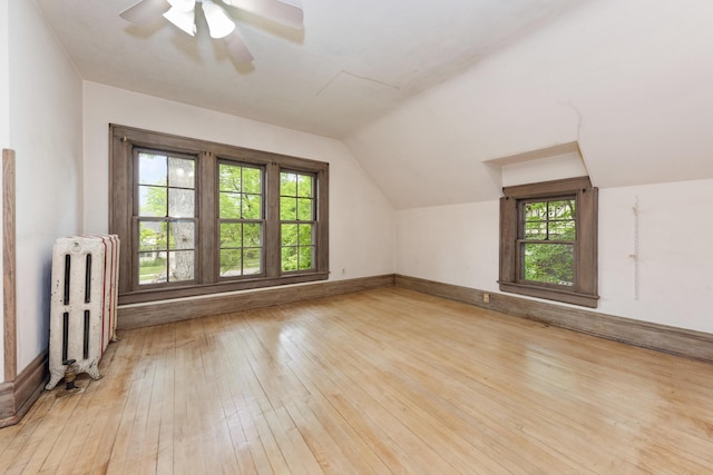 1706 S University Ave, Ann Arbor, MI 48104 - bonus room with radiator, hardwood / wood-style floors, lofted ceiling, ceiling fan, and baseboards