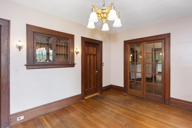 1706 S University Ave, Ann Arbor, MI 48104 - entryway with a chandelier, baseboards, and wood finished floors