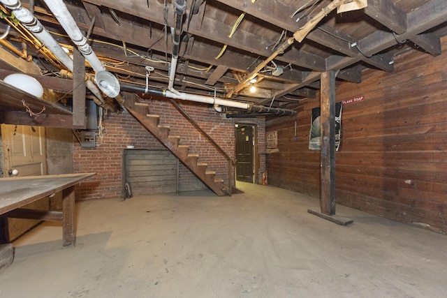 1706 S University Ave, Ann Arbor, MI 48104 - unfinished basement featuring stairway and wooden walls