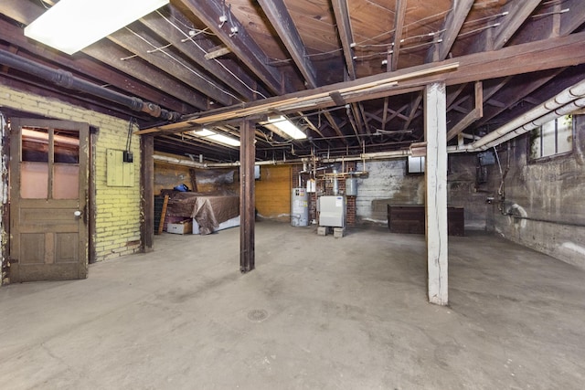 1706 S University Ave, Ann Arbor, MI 48104 - unfinished basement featuring gas water heater