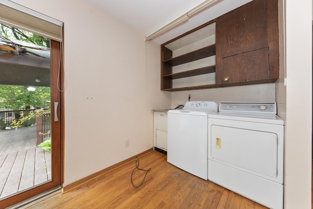 1706 S University Ave, Ann Arbor, MI 48104 - washroom with cabinet space, separate washer and dryer, healthy amount of natural light, and light wood finished floors
