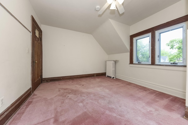 1706 S University Ave, Ann Arbor, MI 48104 - additional living space with radiator heating unit, a ceiling fan, carpet flooring, baseboards, and vaulted ceiling
