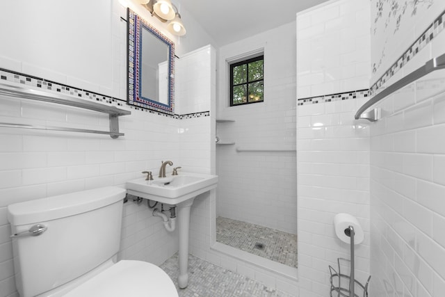 1706 S University Ave, Ann Arbor, MI 48104 - full bath featuring toilet, tiled shower, tile walls, and a sink