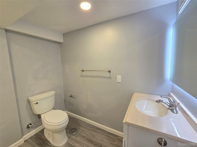 13965 Norborne, Redford, MI 48239 - half bathroom featuring vanity, baseboards, toilet, and wood finished floors