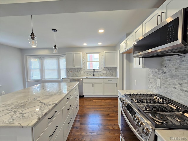13965 Norborne, Redford, MI 48239 - kitchen with appliances with stainless steel finishes, a sink, light stone countertops, tasteful backsplash, and dark wood finished floors