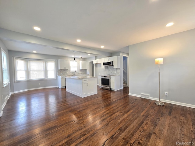 13965 Norborne, Redford, MI 48239 - unfurnished living room with dark wood finished floors, recessed lighting, baseboards, and a sink