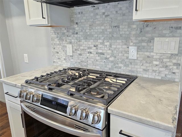 13965 Norborne, Redford, MI 48239 - kitchen view of stainless steel gas range oven, white cabinets, tasteful backsplash, and light stone countertops