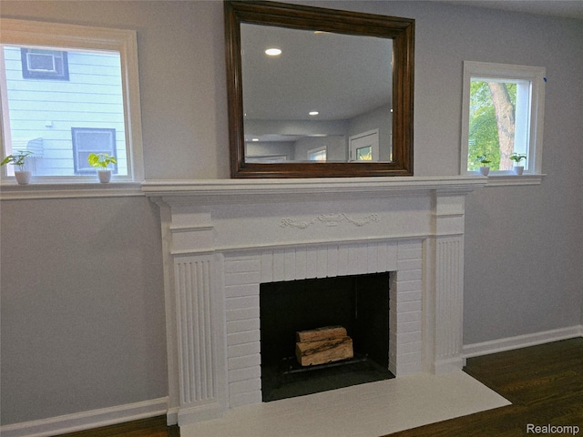 13965 Norborne, Redford, MI 48239 - detailed view of a fireplace, baseboards, wood finished floors, and recessed lighting