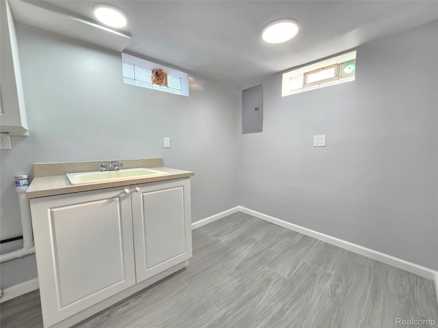 13965 Norborne, Redford, MI 48239 - laundry room featuring electric panel, baseboards, a sink, and healthy amount of natural light