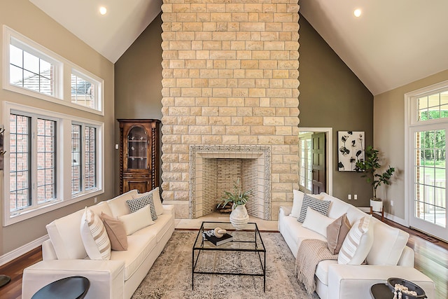 4297 Upper Glade Ct, Ann Arbor, MI 48103 - living area with high vaulted ceiling, baseboards, wood finished floors, recessed lighting, and a brick fireplace