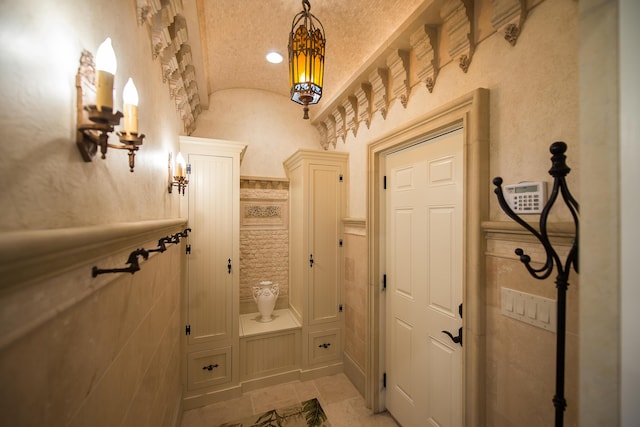 4297 Upper Glade Ct, Ann Arbor, MI 48103 - mudroom featuring vaulted ceiling