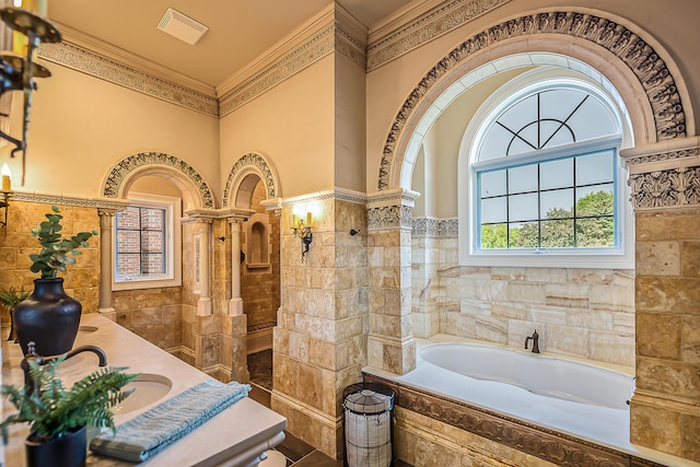 4297 Upper Glade Ct, Ann Arbor, MI 48103 - full bath featuring tile walls, a garden tub, ornamental molding, wainscoting, and double vanity