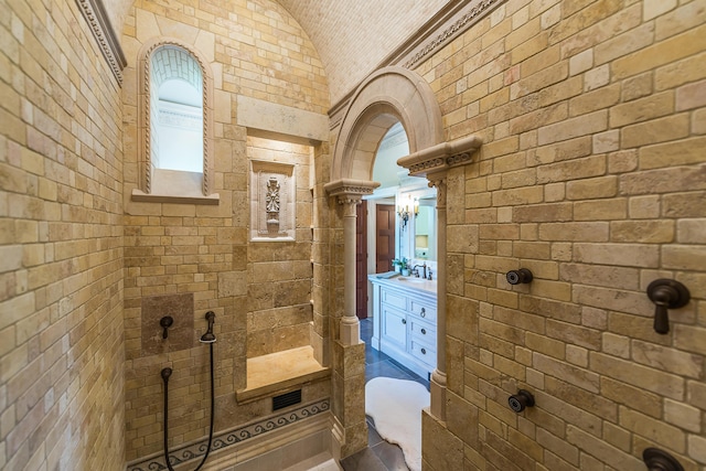 4297 Upper Glade Ct, Ann Arbor, MI 48103 - full bath featuring vaulted ceiling, vanity, and walk in shower