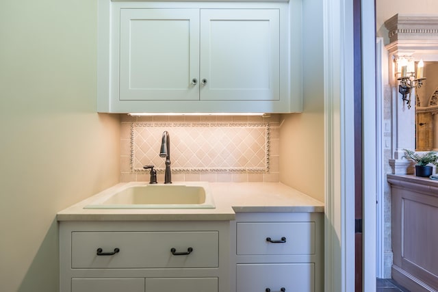 4297 Upper Glade Ct, Ann Arbor, MI 48103 - bar with a sink and tasteful backsplash