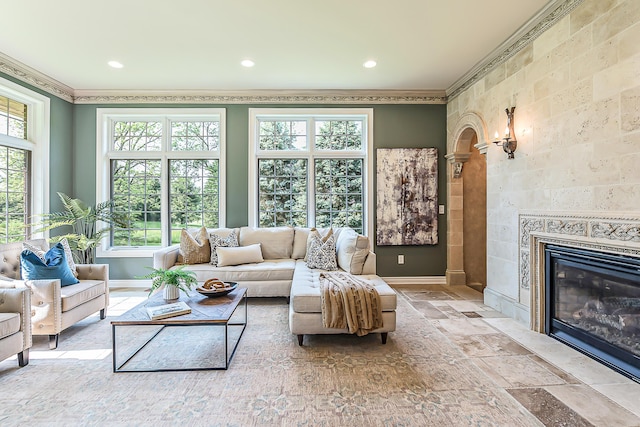 4297 Upper Glade Ct, Ann Arbor, MI 48103 - living room featuring ornamental molding, baseboards, stone tile floors, a fireplace, and recessed lighting